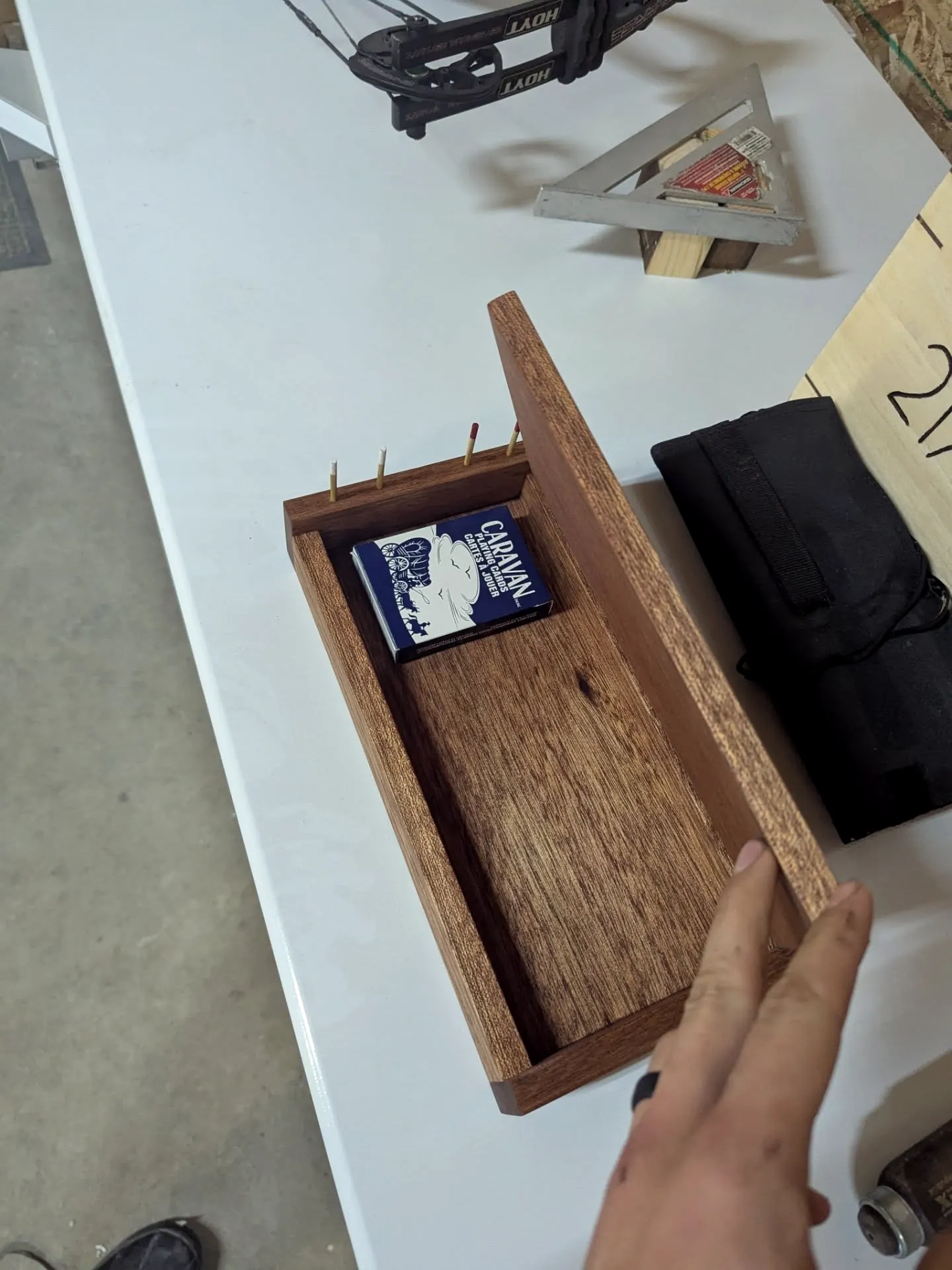 Cribbage board box opened with cards inside