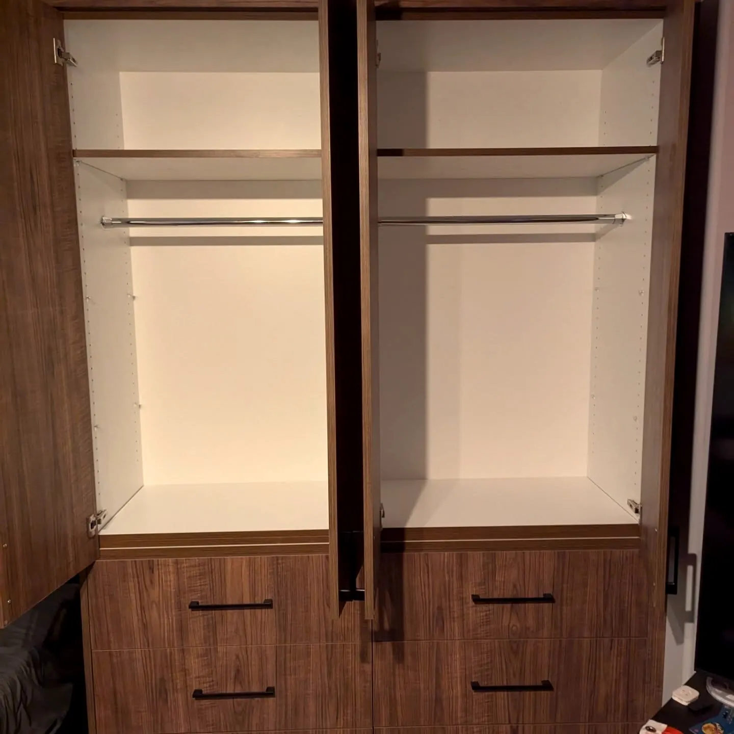 Wardrobe interior with hanging rails and drawers