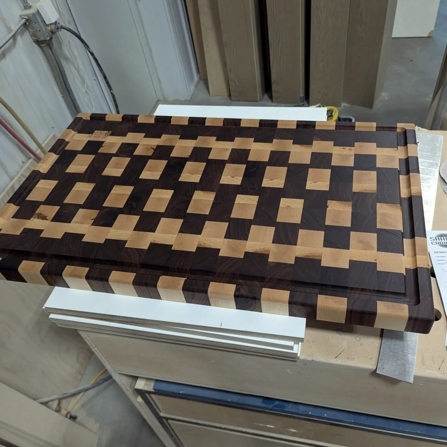 End-grain cutting board with juice groove