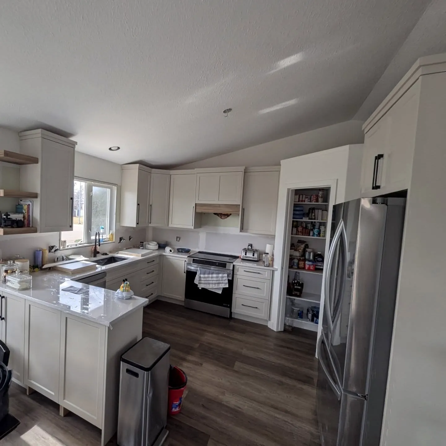 White kitchen with stainless appliances