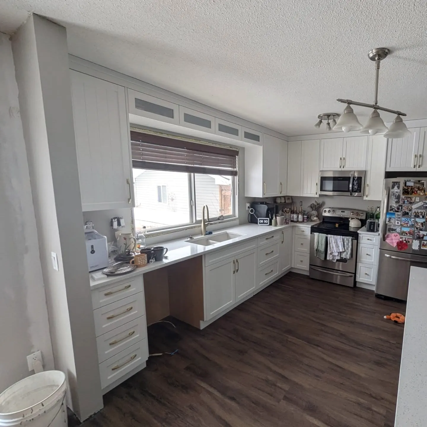 White kitchen with a window over the sink