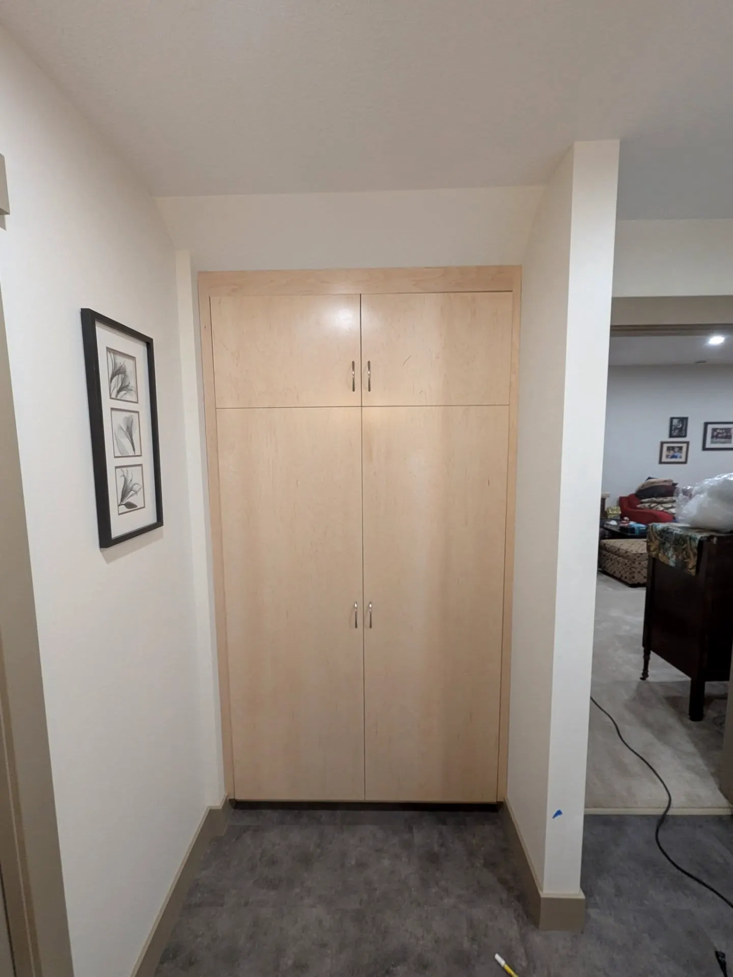 Built-in linen cabinet in a hallway
