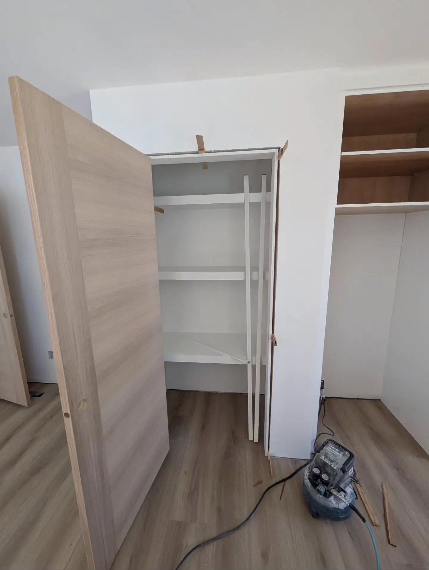 Closet shelves and a newly hung door