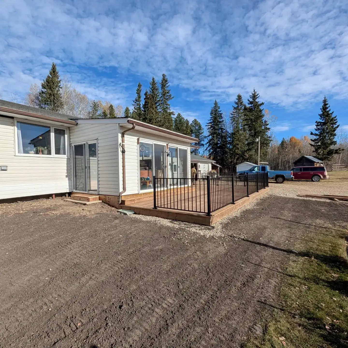 New deck along the back of an acreage home