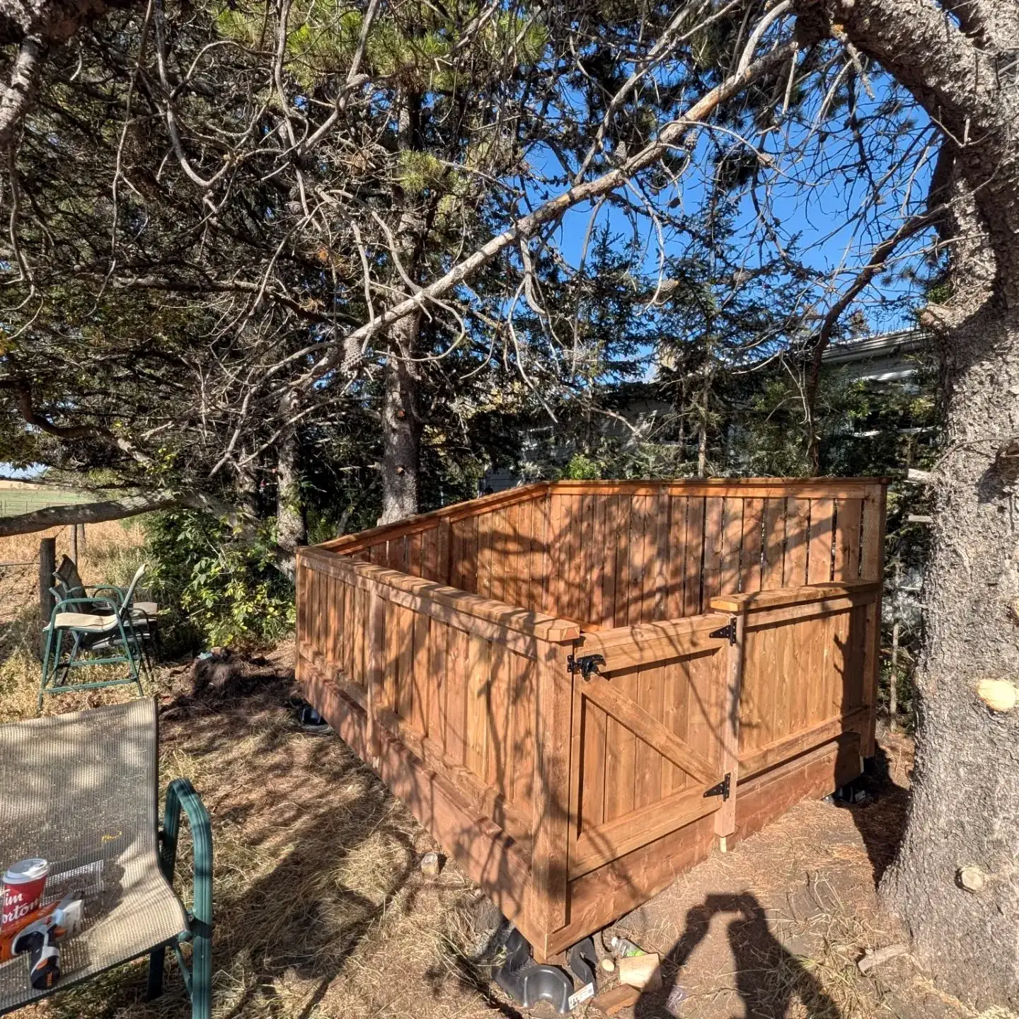Deck with privacy railing built around a big tree