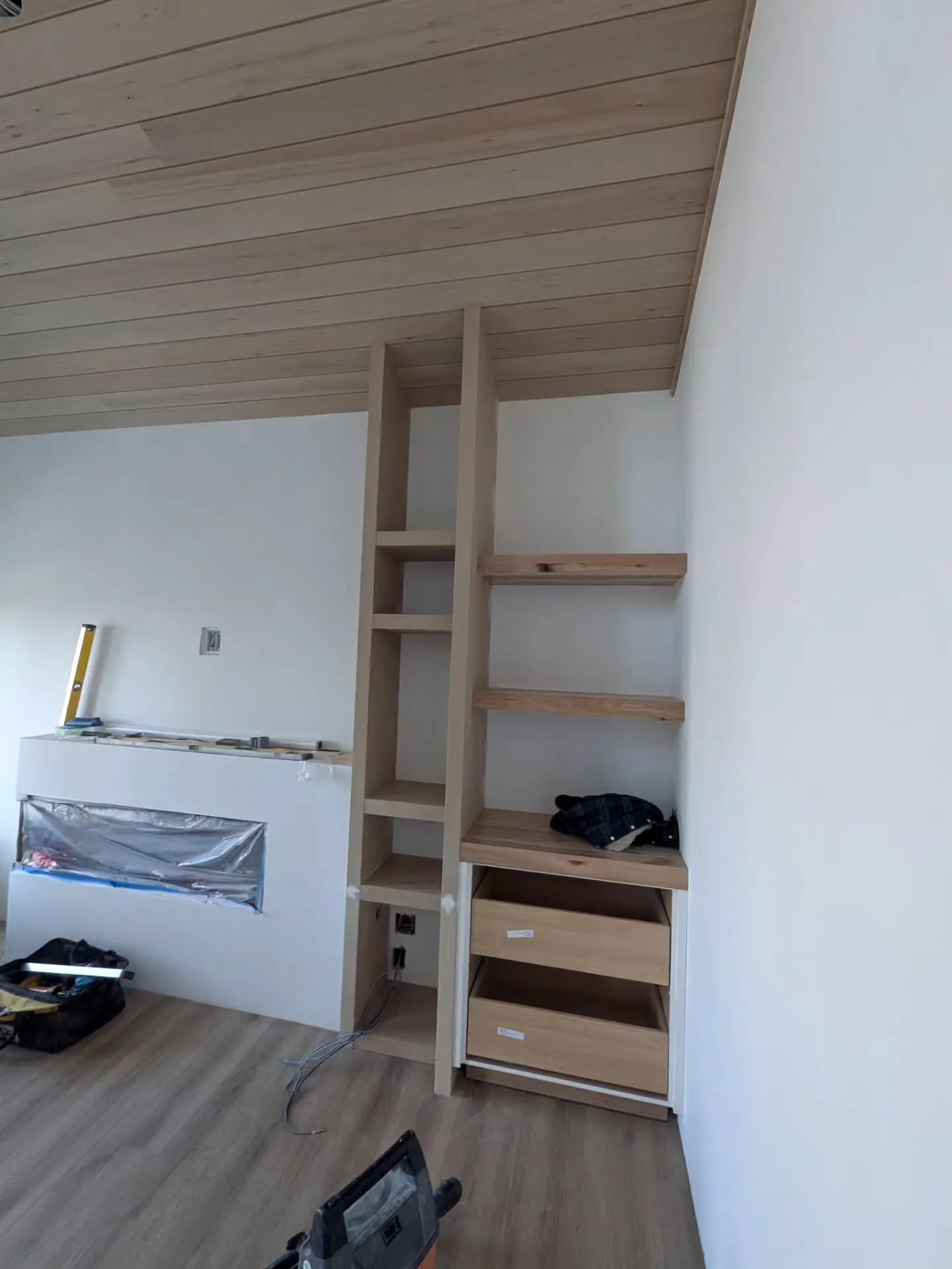 Shelving unit under a 10.5 foot vaulted pine ceiling