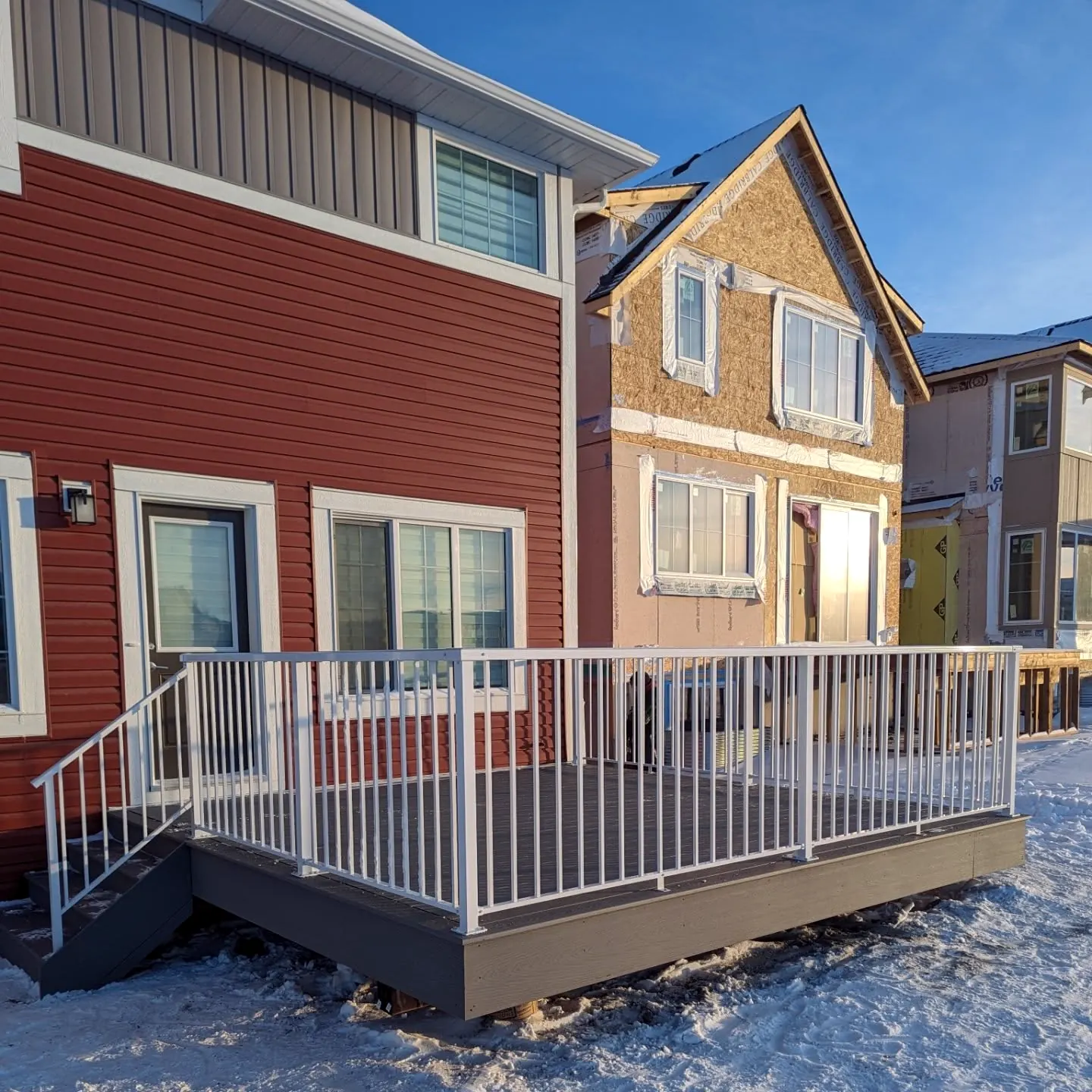 Deck with white aluminum railing in winter